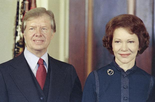 FILE - President-elect Jimmy Carter, left, with his wife Rosalynn Carter on Dec. 3, 1976. (AP Photo/Charles Harrity, File)