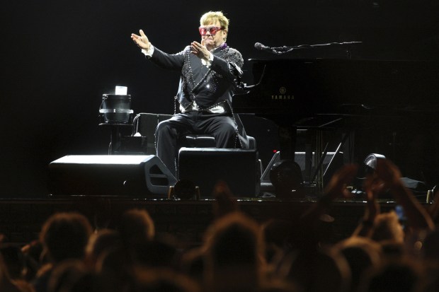 Elton John performs during his final Chicago concert at Soldier Field on Aug. 5, 2022. (Antonio Perez / Chicago Tribune)