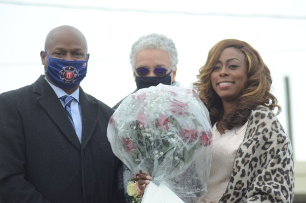 Tiffany Henyard was presented with flowers from Illinois House Speaker Emanuel Chris Welch and Cook County Board President Toni Preckwinkle at her inauguration in May 2021.