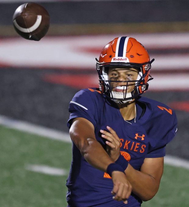 Naperville North's Jacob Bell (2) passes in the second quarter in the quarter during an DuPage Valley Conference game against Naperville Central at North Central College on Friday, Sept. 6, 2024. (H. Rick Bamman / Naperville Sun)