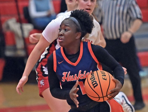 Naperville North's Natalie Frempong drives for a layup against Hinsdale Central's defense. Naperville North lost to Hinsdale Central 71-41 in a girls basketball game Tuesday, Dec. 10, 2024, in Hinsdale, Illinois. (Jon Langham/for the Naperville Sun)