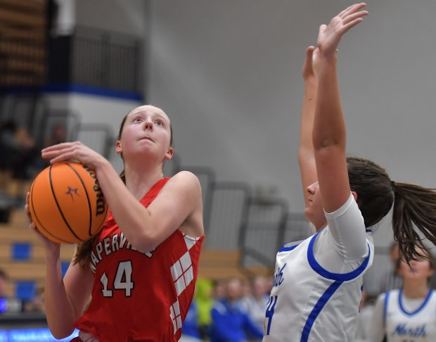 Naperville Central's Annabelle Kritzer takes the ball to the basket during a game against St. Charles North Tuesday, Dec. 3, 2024 in St. Charles...(Jon Cunningham/for The Naperville Sun)