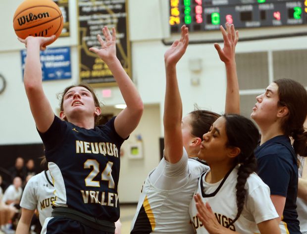 Neuqua Valley's Nalia Clifford goes for the basket as Metea Valley defends during the DuPage Valley Conference girls basketball game in Aurora on Thursday, Dec. 12, 2024. (James C. Svehla / Naperville Sun)