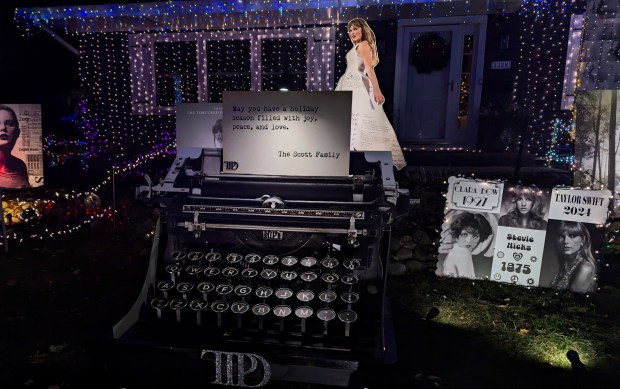 A hand-made typewriter sits in the front lawn of Amy and Brian Scott's Naperville home near Atlas Lane and Tupelo Avenue as part of their Taylor Swift holiday display, pictured here on Tuesday, Dec.3, 2024. (Tess Kenny/Naperville Sun)