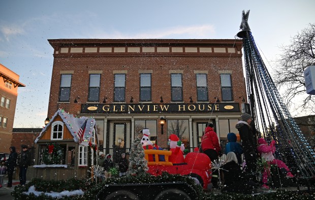 A parade float passes by Glenview House at the Nov. 30, 2024 at the Holiday in the Park and Parade in downtown Glenview. (Karie Angell Luc/Pioneer Press)