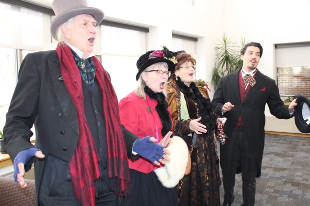 The multifaceted Winter Holiday Market in Deerfield offered a holiday gift market featuring local vendors, live music and entertainment, visits with Santa Claus, a Christmas train and life-sized snow globe inflatable, children's crafts and activities, an array of civic and non-profit organizations, and food for purchase. Here, the Frozen Robins perform.(Gina Grillo/ For the Pioneer Press)