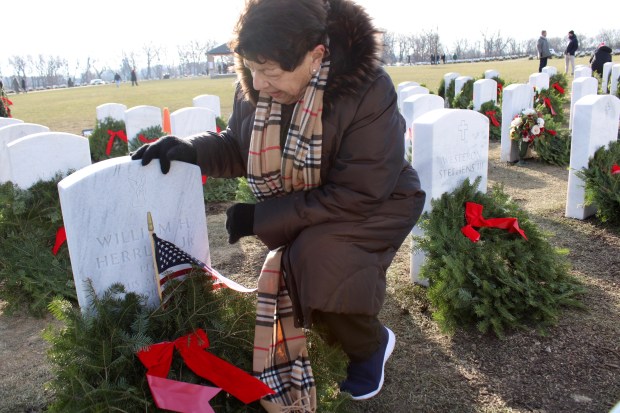 Rosemarie Herrlin of Lake Forest lost her husband, William Herrlin, a veteran of the Korean War, in June 2024, just three months short of their 50th wedding anniversary, during the Fallen Hero Wreath Ceremony at Fort Sheridan National Cemetery on Saturday, Dec. 14, in appreciation for those who served in our nation's military and for their sacrifice for our freedom. (Gina Grillo/ For the Pioneer Press)