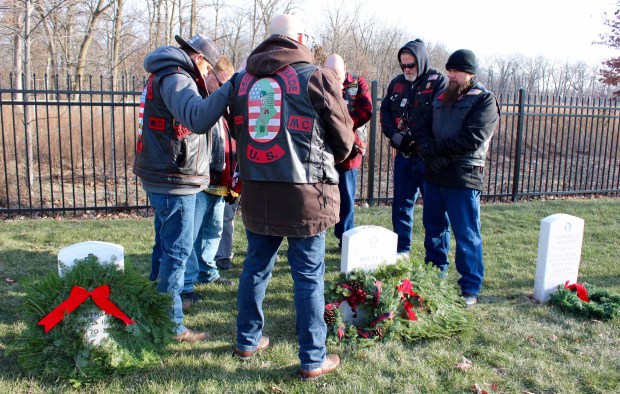 Members of Rolling Thunder join together to honor their fallen comrade, during the Fallen Hero Wreath Ceremony at Fort Sheridan National Cemetery on Saturday, Dec. 14, in appreciation for those who served in our nation's military and for their sacrifice for our freedom. (Gina Grillo/ For the Pioneer Press)