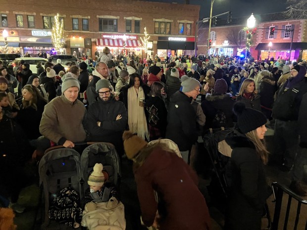 A large crowd outside the La Grange Village Hall on Saturday evening awaits Santa and Mrs. Claus, who were scheduled to throw the switch on the 2024 Christmas tree and then visit with area children during the La Grange Holiday Walk. (Hank Beckman/Pioneer Press)