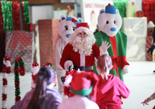 Santa arrives at IceLand Ice Arena in Niles Dec. 15, 2024 to ice skate with participants. (Talia Sprague/for Pioneer Press)