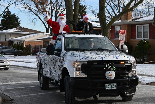 Santa Claus is in the neighborhood with Norridge Village President Dan Tannhauser at the Santa Send Off on Dec. 21, 2024 in Norridge. (Karie Angell Luc/Pioneer Press)