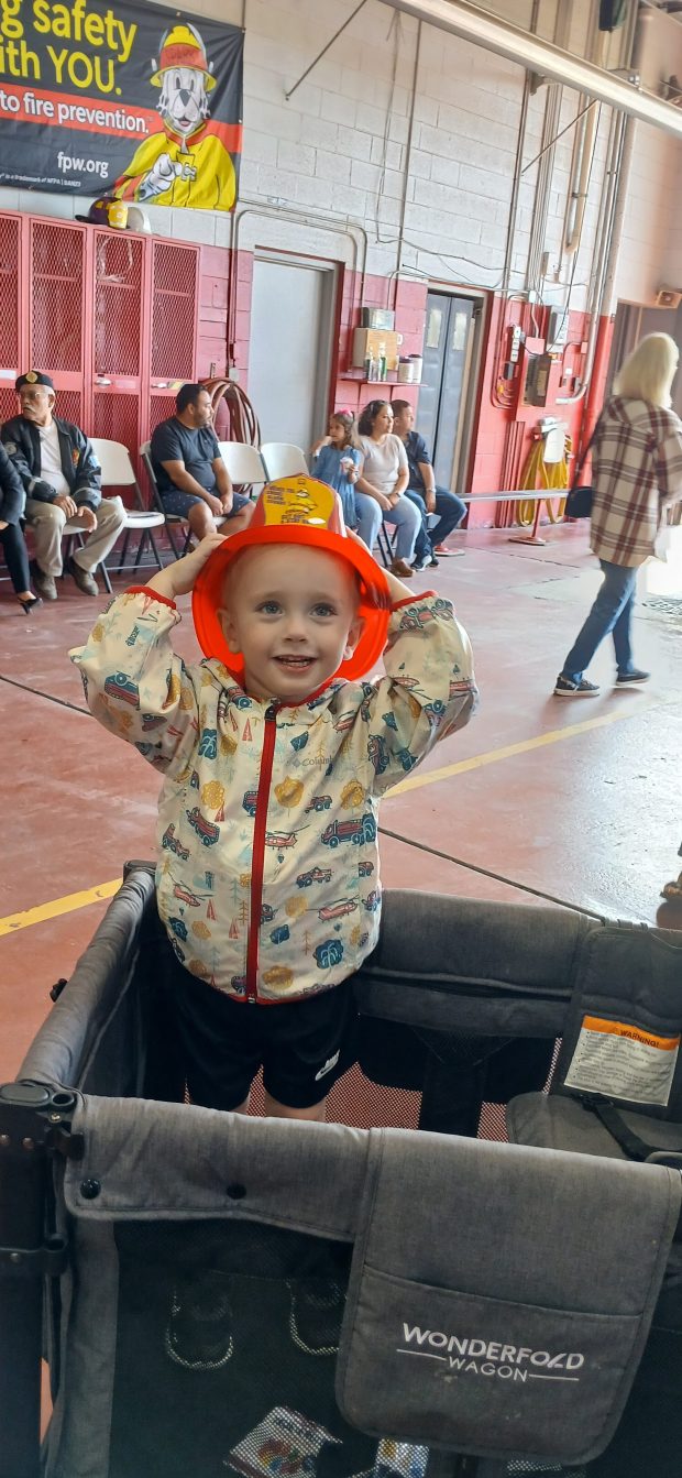 Teddy Ban, 2, enjoys the festivities at the main Fire Station in Hobart. (Sue Ellen Ross/Post-Tribune)