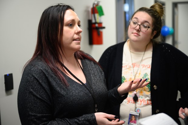 Stepping Stones Early Learning Center representatives Hilary Ledbetter, on left, and Savannah Yuhasz speak during a ribbon-cutting celebration for the NEO Creekside Early Learning Center in Portage on Tuesday, Dec. 3, 2024. (Kyle Telechan/for the Post-Tribune)