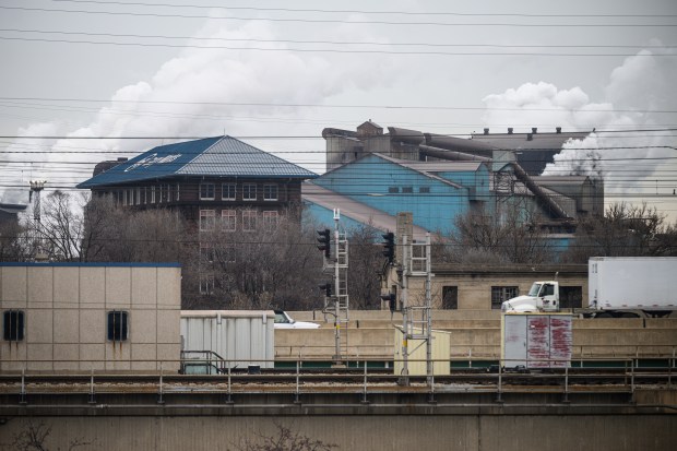 Steam pours from US Steel Gary Works across the street from Gary City Hall during a press conference concerning the potential acquisition of the company by Japanese company Nippon Steel, on Thursday, Dec. 12, 2024. (Kyle Telechan/for the Post-Tribune)