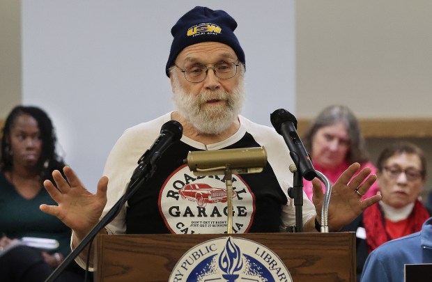 Retired steel worker Paul Kaczocha addresses the panel during the Indiana Utility Regulatory Commission hearing on NIPSCO's proposed 20% rate increase, which would drive up residential customers' monthly bills around $45 per month. The meeting took place at the Woodson Branch Library in Gary on Thursday, Dec. 5, 2024. (John Smierciak / Post Tribune)