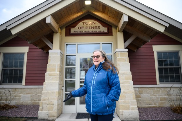 Town of Pines resident Cathi Murray speaks about previous coal ash cleanup operations near the town hall on Thursday, Dec. 12, 2024. (Kyle Telechan/for the Post-Tribune)