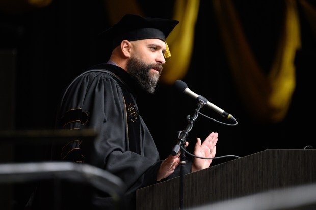 Purdue University Northwest alumnus and founder and CEO of WeCreate Media, Wade Breitzke, performs the keynote speech during the school's Fall commencement ceremony in Hammond on Saturday, Dec. 14, 2024. (Kyle Telechan/for the Post-Tribune)