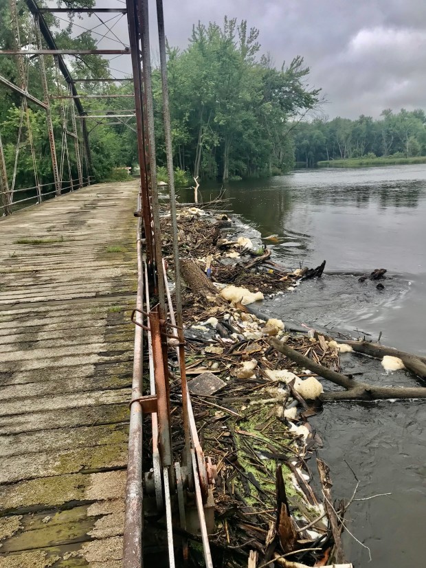 Debris piles up alongside State Line Bridge, exacerbating flooding in the area. (Scott Pelath/provided)