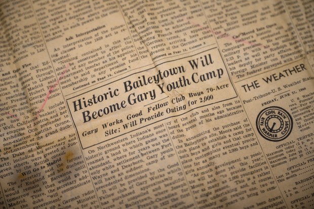 A headline announcing the founding of the Good Fellow Club can be seen in an issue of the Gary Post-Tribune from Friday, June 21, 1940, as items uncovered earlier this year during construction on the lodge are displayed by Indiana Dunes National Park archaeology expert Judy Collins on Wednesday, Oct. 9, 2024. (Kyle Telechan/for the Post-Tribune)