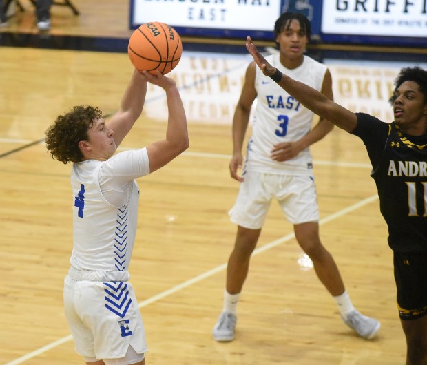 Lincoln-Way East's Evan Riiff (4) puts up a shot against Andrew's Dionte Thigpen (11) during a SouthWest Suburban Conference game Wednesday, Dec. 4, 2024 in Frankfort, IL. (Steve Johnston/for the Daily Southtown)