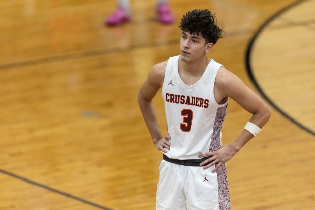 Brother Rice's Marcos Gonzales (3) waits for play to start up again against Oak Lawn during the Team Rose Shootout at Mount Carmel in Chicago on Saturday, Dec. 14, 2024. (Vincent D. Johnson / for the Daily Southtown)