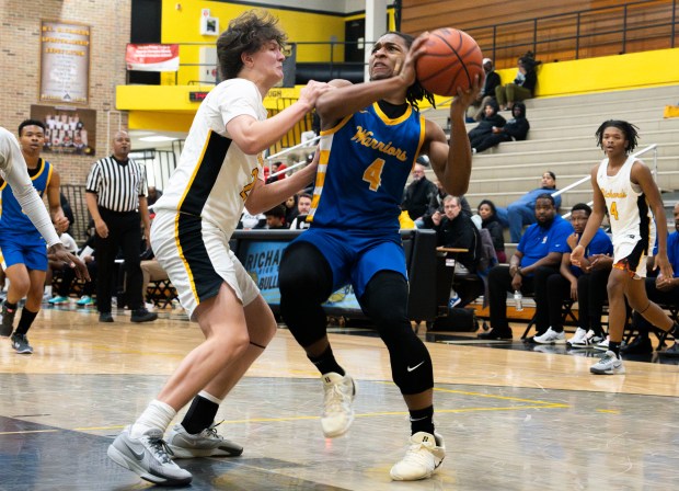 Crete Monee's Zyheir Gardner (4) aims to shoot the ball during a game at Richards High School in Oak Lawn on Tuesday, Dec. 17, 2024. (Nate Swanson / for the Daily Southtown)