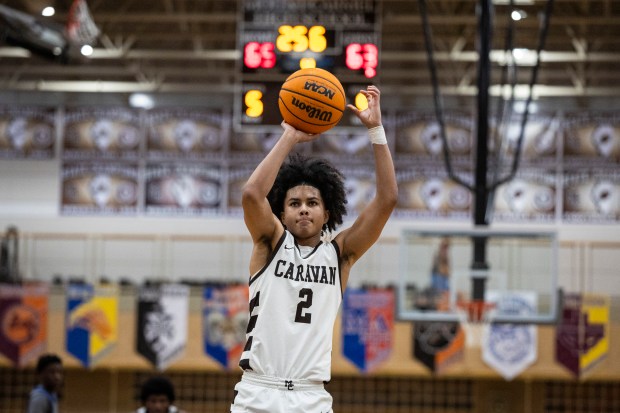 Mount Carmel's Noah Mister (2) takes final free throw to give the Caravan a 66-63 lead over De La Salle with 25.6 second left during a Chicago Catholic League Blue game in Chicago on Friday, Dec. 13, 2024. (Vincent D. Johnson / for the Daily Southtown)