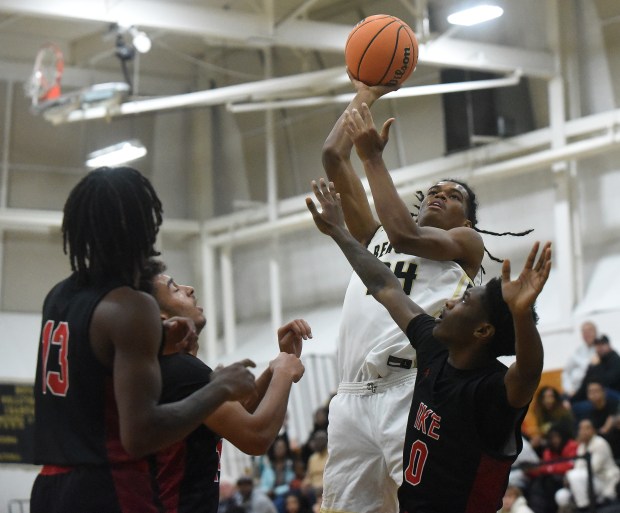 Oak Forest's Matthew Anderson (24) puts up a shot against Eisenhower during a South Suburban Conference game Friday, Dec. 6, 2024 in Oak Forest, IL. (Steve Johnston/for the Daily Southtown)