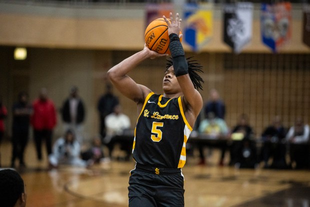 St. Laurence's Emmanuel Mosley Jr (5) puts up a jump shot against Homewood-Flossmoor during the Team Rose Shootout at Mount Carmel in Chicago on Sunday, Dec. 15, 2024. (Vincent D. Johnson / for the Daily Southtown)