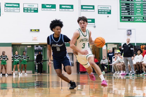 Oak Lawn's Jack Dempsey (3) drives to the basket against Hillcrest during a SSC game in Oak Lawn on Tuesday, Dec. 10, 2024. (Troy Stolt / for the Daily Southtown)