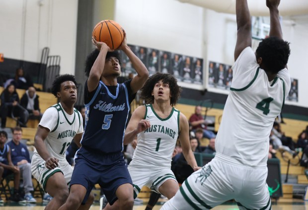 Hillcrest guard Jovian Ratliff (5) shoots a lay up during a game at Evergreen Park Community High School in Evergreen Park on Friday, Dec. 6, 2024. (Talia Sprague / Daily Southtown)