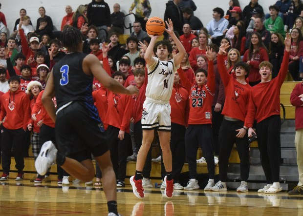 Lincoln-Way Central's Kevin Barrett (11) puts up a three point attempt against Lincoln-Way East during a SouthWest Suburban Conference game Tuesday, Dec. 17, 2024 in New Lenox, IL. (Steve Johnston/for the Daily Southtown)