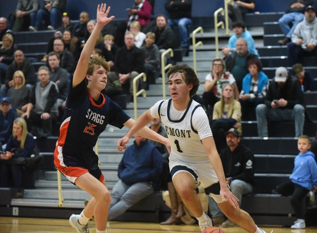 Lemont's Zane Schneider (1) drives the baseline against Stagg's Nikolai Zumerchik (25) during a nonconference game Tuesday, Dec. 3, 2024 in Lemont, IL. (Steve Johnston/for the Daily Southtown)