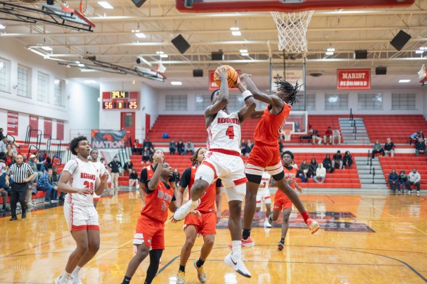 Marist's Karson Thomas (4) goes up for a layup against TF South during a non-conference game in Chicago on Tuesday, Dec. 3, 2024. (Troy Stolt / for the Daily Southtown)