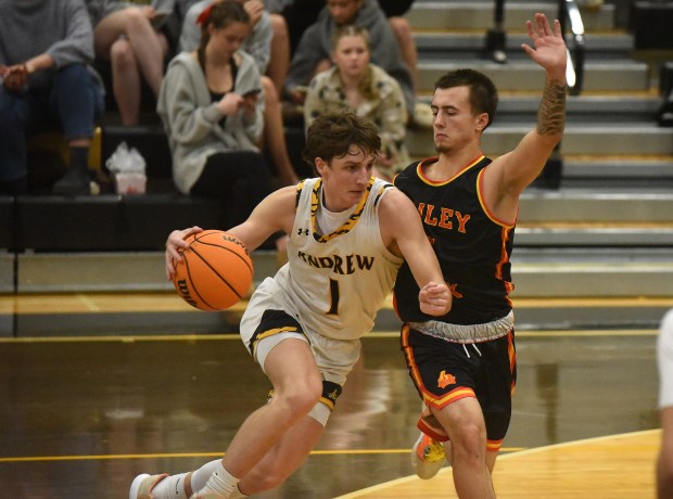 Andrew's Scott Dinnon (1) tries to dribble past Tinley Park's Nolan Maciejewski (5) during a nonconference game Wednesday, Dec. 18, 2024 in Tinley Park, IL. (Steve Johnston/for the Daily Southtown)