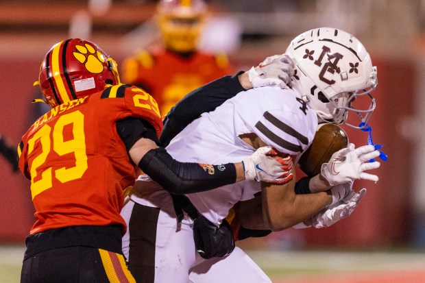 Mount Carmel's Quentin Burrell (4) manages to hold onto the ball on a touchdown reception against Batavia in the Class 7A state championship game at Hancock Stadium in Normal on Saturday, Nov. 30, 2024. (Vincent D. Johnson / for the Daily Southtown)