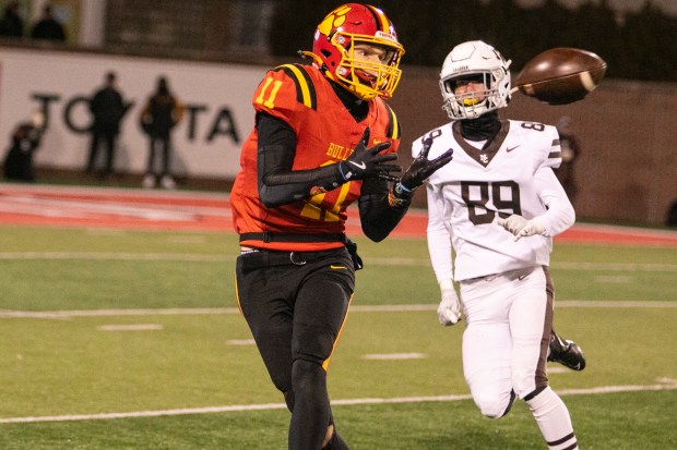 Batavia's Brett Berggren (11) catches a pass as Mount Carmel's Matthew Doyle (89) defends in the Class 7A state championship game at Hancock Stadium in Normal on Saturday, Nov. 30, 2024. (Vincent D. Johnson / for the Daily Southtown)