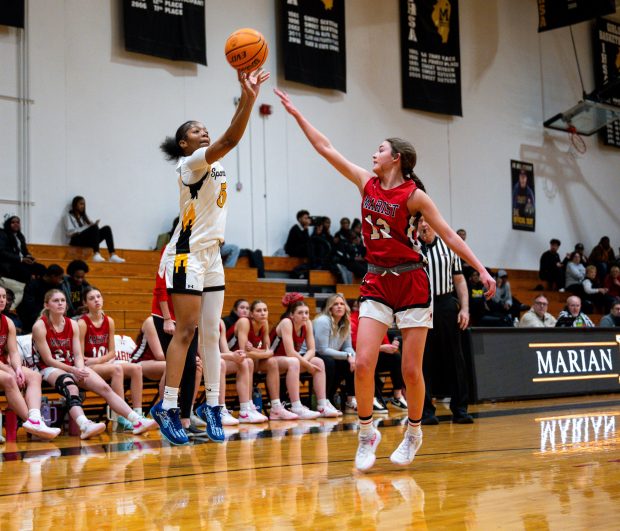 Marian Catholic's LaParis Poe (5) shoots during a game against Marist on Wednesday, Dec. 11, 2024, at Marian Catholic High School in Chicago Heights, Ill. (Vincent Alban / Daily Southtown)