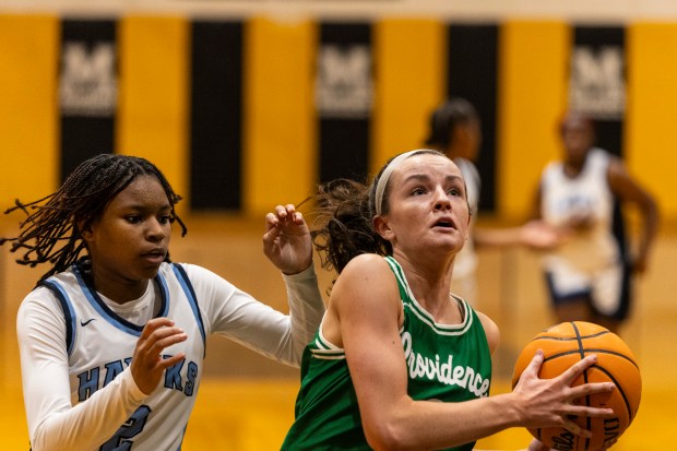 Providence's Molly Knight (3) goes to the basket against Hillcrest during the Marian Catholic Holiday Tournament in Chicago Heights on Wednesday, Dec.18, 2024. (Vincent D. Johnson / for the Daily Southtown)