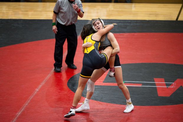 Lincoln-Way's Zoe Dempsey, right, wrestles Andrew's Keira Zamudio, left, during a dual meet on Wednesday, Dec. 11, 2024, at Lincoln-Way Central High School in New Lenox, Ill. (Vincent Alban / Daily Southtown)