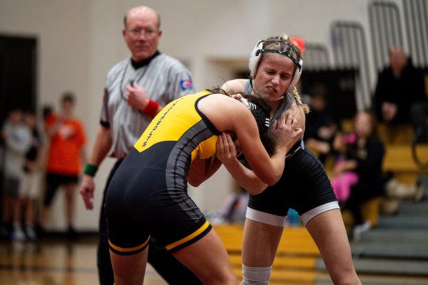 Lincoln-Way's Zoe Dempsey, right, wrestles Andrew's Keira Zamudio, left, during a dual meet on Wednesday, Dec. 11, 2024, at Lincoln-Way Central High School in New Lenox, Ill. (Vincent Alban / Daily Southtown)