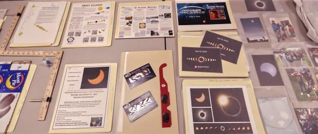 Items that were placed inside the capsule during the IUN Time Capsule Sealing Ceremony. The capsule will preserve some of the memories and materials from April 8's solar eclipse. The capsule isn't set to be opened until 2099 when the next eclipse rolls around. The closing ceremony took place on Monday, Dec. 9, 2024. (John Smierciak / Post-Tribune)