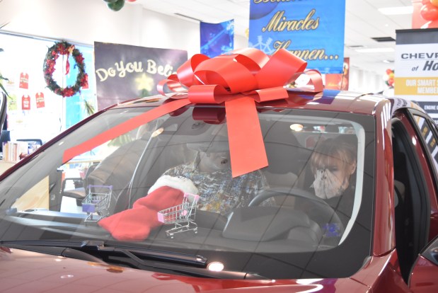 Deanna Recklaus, of Oak Lawn, sits in her Chevy Trax Dec. 24, 2024, for the first time. (Jesse Wright/for the Daily Southtown)