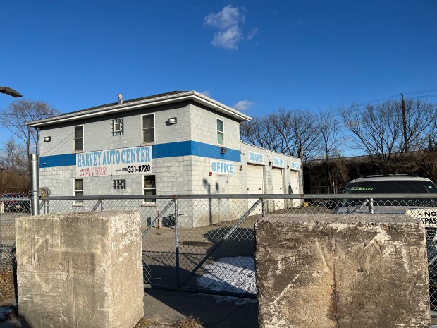 Harvey Auto Center, an auto repair shop owned by Benecia Gonzalez, was forced to halt operations after the city installed cement barricades blocking both the front and back entrances to the lot. (Samantha Moilanen/Daily Southtown)