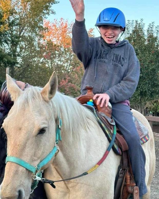 Cole, a participant at HHH Ranch, rides Toast the horse. Cole is nonverbal and was once terrified of Toast, but they ride together without assistance now, said Christine Doran, HHH Ranch founder and president. (HHH Ranch)