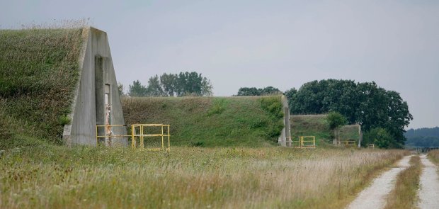 A row of former TNT storage bunkers at the USDA Forest Service's Midewin National Tallgrass Prairie are pictured in 2006 on the site of the former Joliet Arsenal in Wilmington. Decades later, officials still are figuring out what to do with some of the structures. (George Thompson/Chicago Tribune)