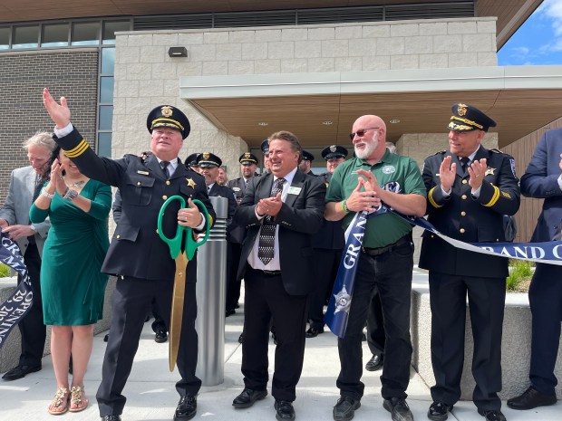 Police Chief Brian Benton invites members of the public to tour the new Mokena police station May 29, 2024, after a ribbon-cutting ceremony. (Michelle Mullins/for Daily Southtown)