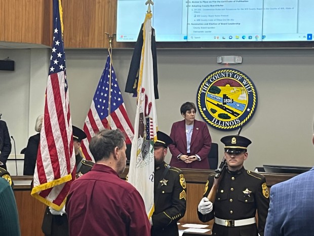 County Executive Jennifer Bertino-Tarrant, who was reelected last month, watches the posting of colors Dec. 2, 2024. (Michelle Mullins/for the Daily Southtown)