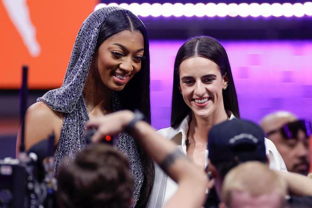 Angel Reese, left, and Caitlin Clark, right, pose for a photo before the WNBA basketball draft on Monday, April 15, 2024, in New York. (AP Photo/Adam Hunger, File)