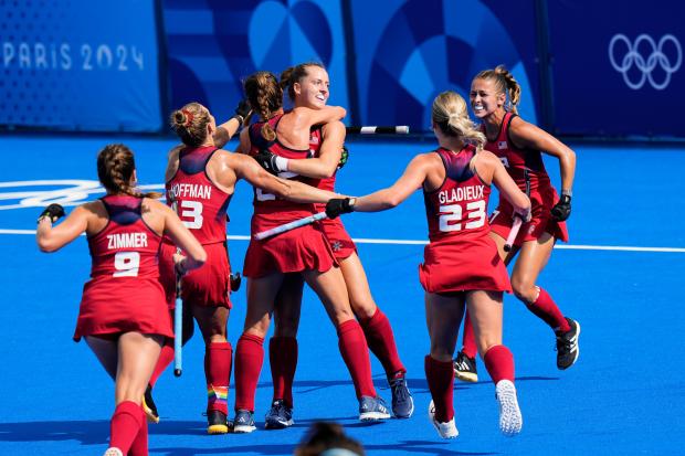 United States' Abigail Tamer, third right, celebrates with teammates after scoring her side's first goal during the women's Group B field hockey match against Britain at the Yves-du-Manoir Stadium during the 2024 Summer Olympics on Aug. 1, 2024, in Colombes, France. (AP Photo/Aijaz Rahi)